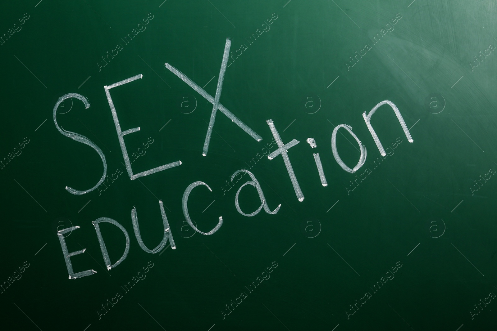 Photo of Phrase "SEX EDUCATION" written on green chalkboard