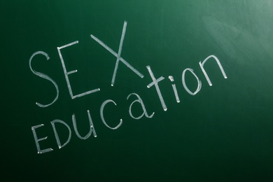 Phrase "SEX EDUCATION" written on green chalkboard