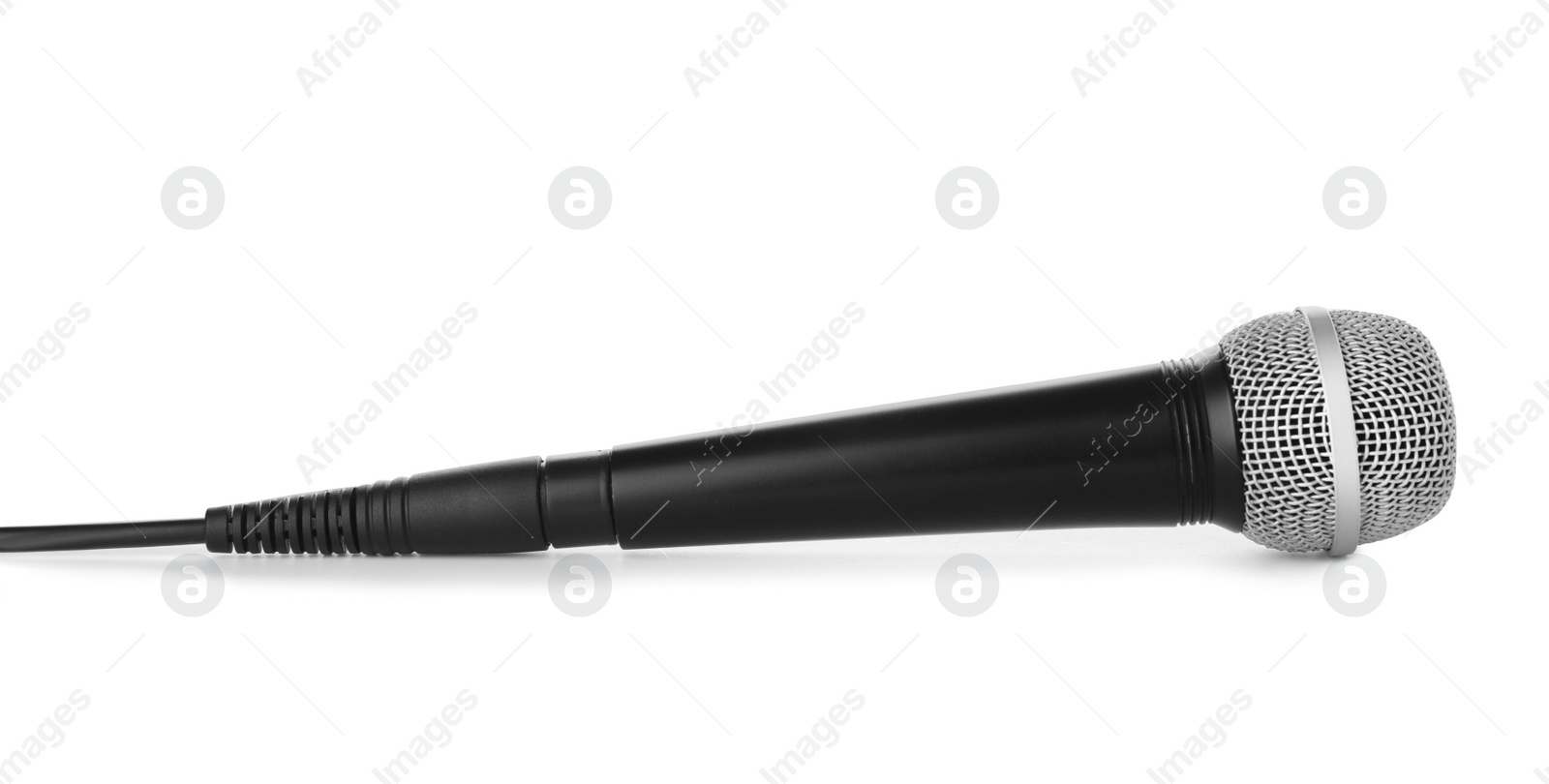 Photo of Microphone with wire on white background. Professional audio equipment