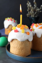 Photo of Beautiful Easter cakes on dark grey table
