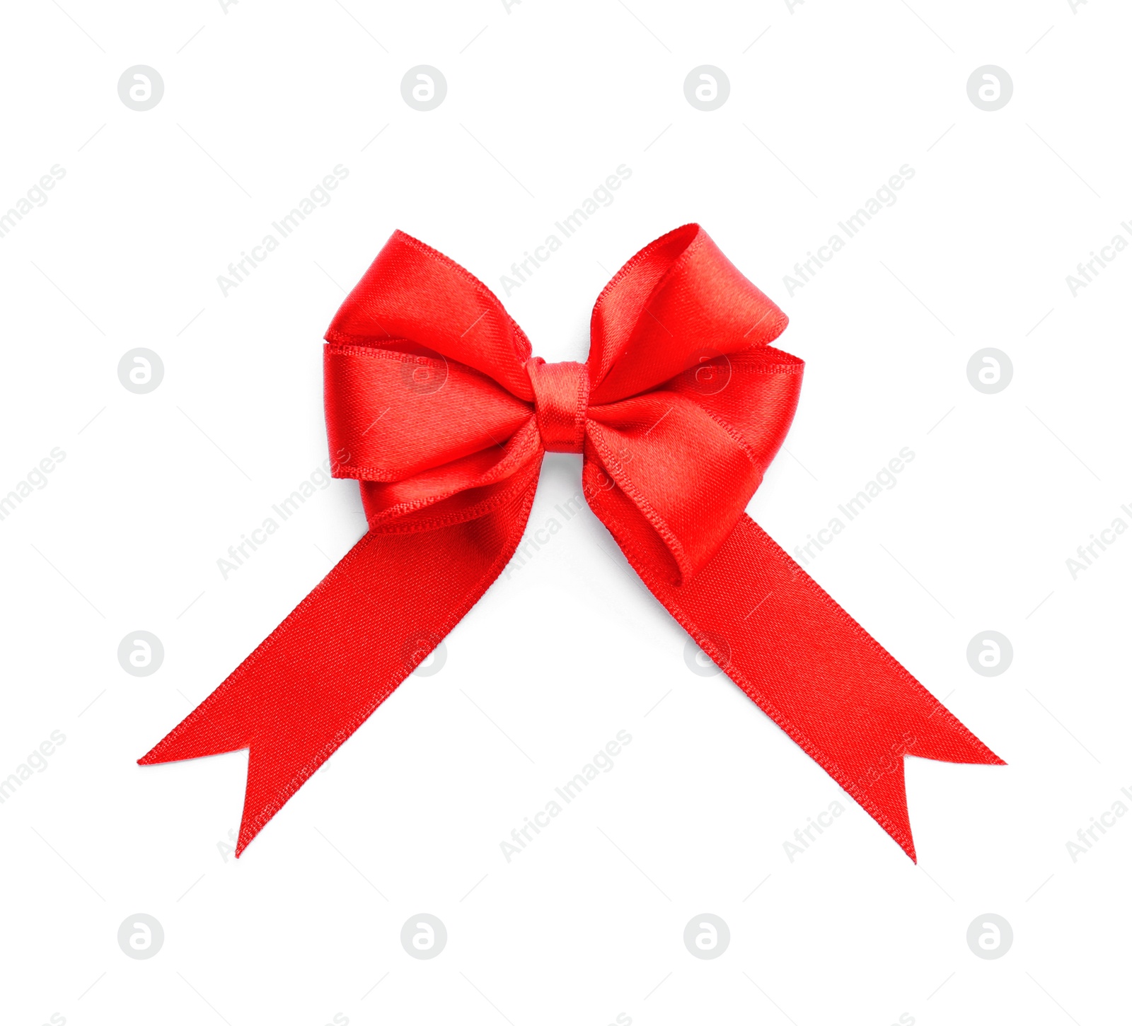 Photo of Red ribbon bow on white background, top view