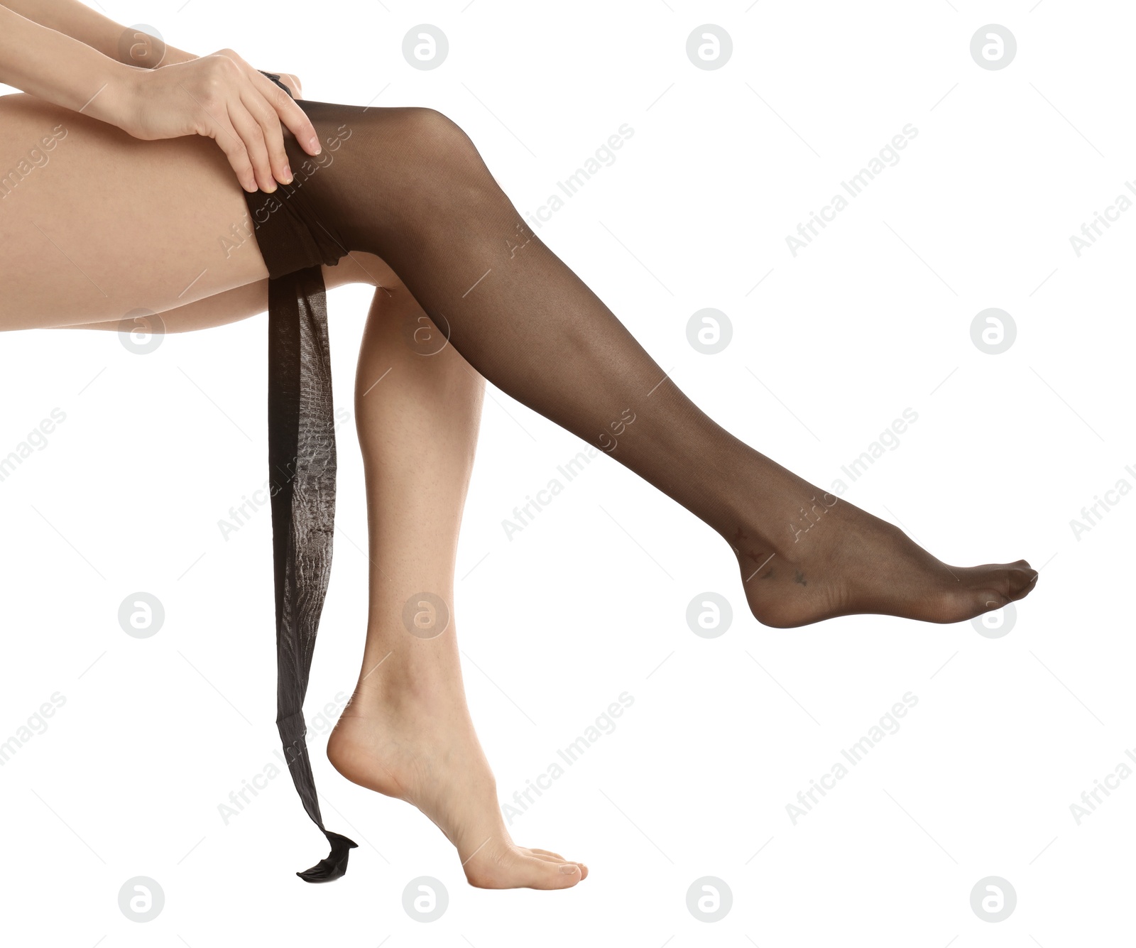 Photo of Woman putting on tights on white background, closeup