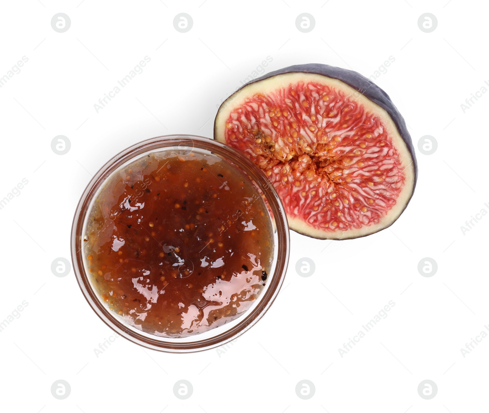 Photo of Glass bowl of tasty sweet fig jam isolated on white, top view