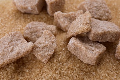 Photo of Refined and granulated brown sugar as background, closeup