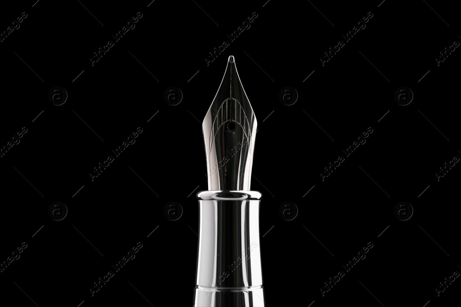 Photo of Stylish silver fountain pen on black background, closeup