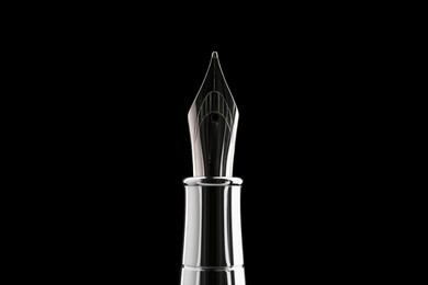 Stylish silver fountain pen on black background, closeup