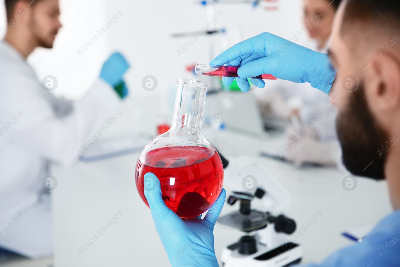 Photo of Medical student working in modern scientific laboratory, closeup