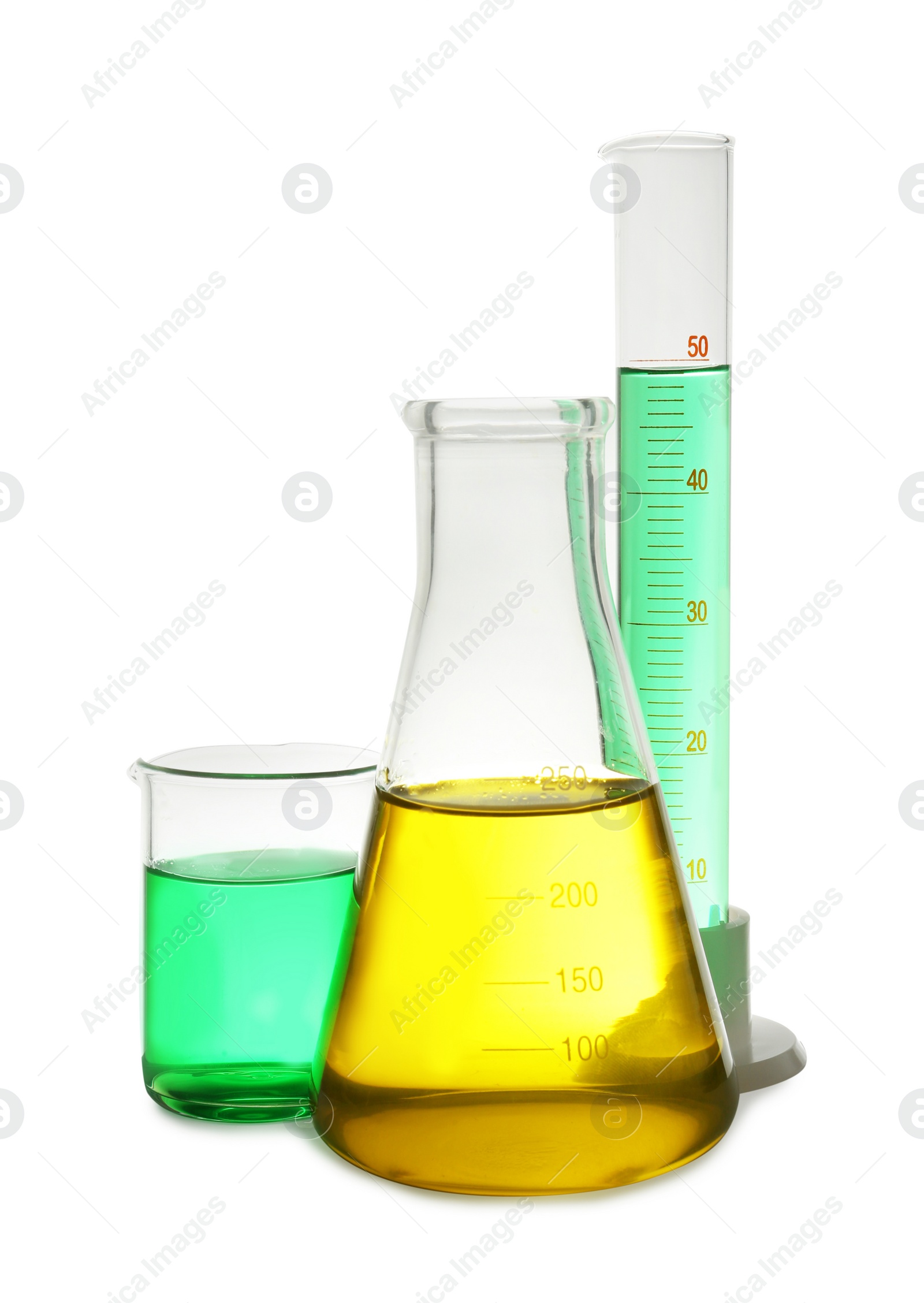 Photo of Laboratory glassware with colorful liquids on white background