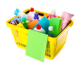 Yellow shopping basket with different household chemicals on white background