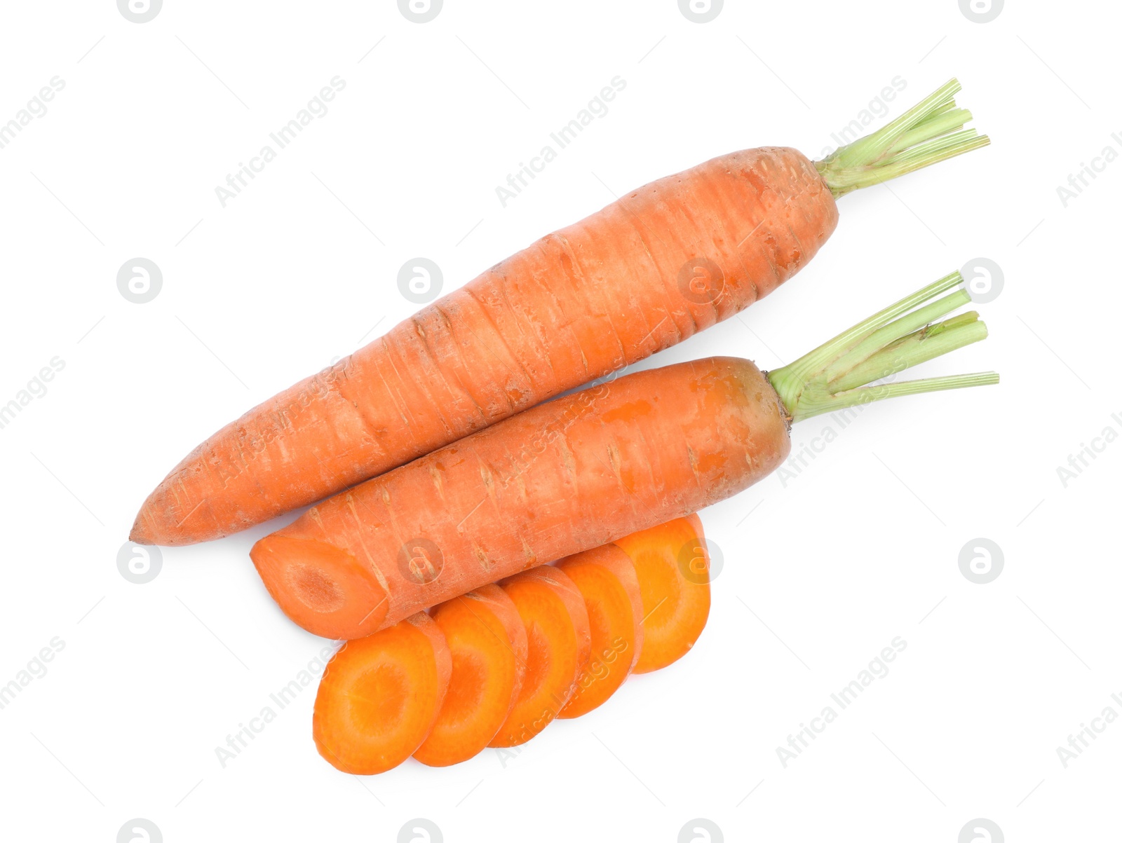 Photo of Tasty ripe organic carrots on white background, top view