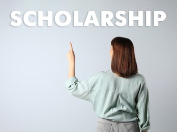 Image of Scholarship concept. Student on light background, back view
