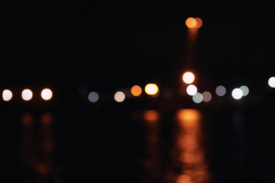 Photo of Blurred view of port at night. Bokeh effect