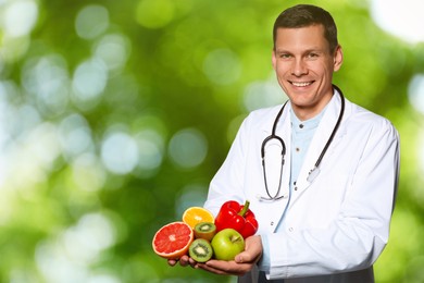 Image of Nutritionist with fresh products on blurred green background