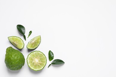 Photo of Flat lay composition with ripe bergamot fruits on white background. Space for text