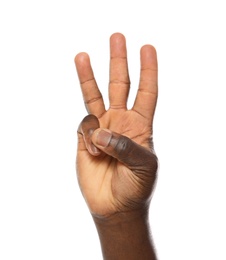 Photo of African-American man showing number THREE on white background, closeup