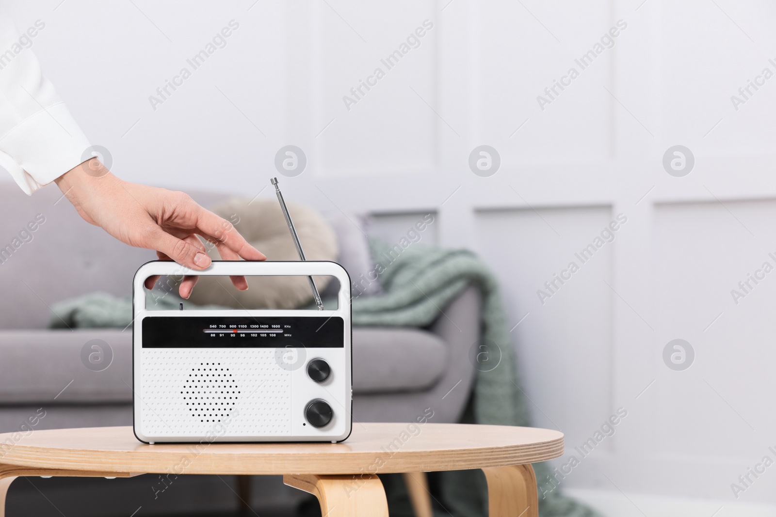 Photo of Woman with stylish white radio at home, closeup. Space for text