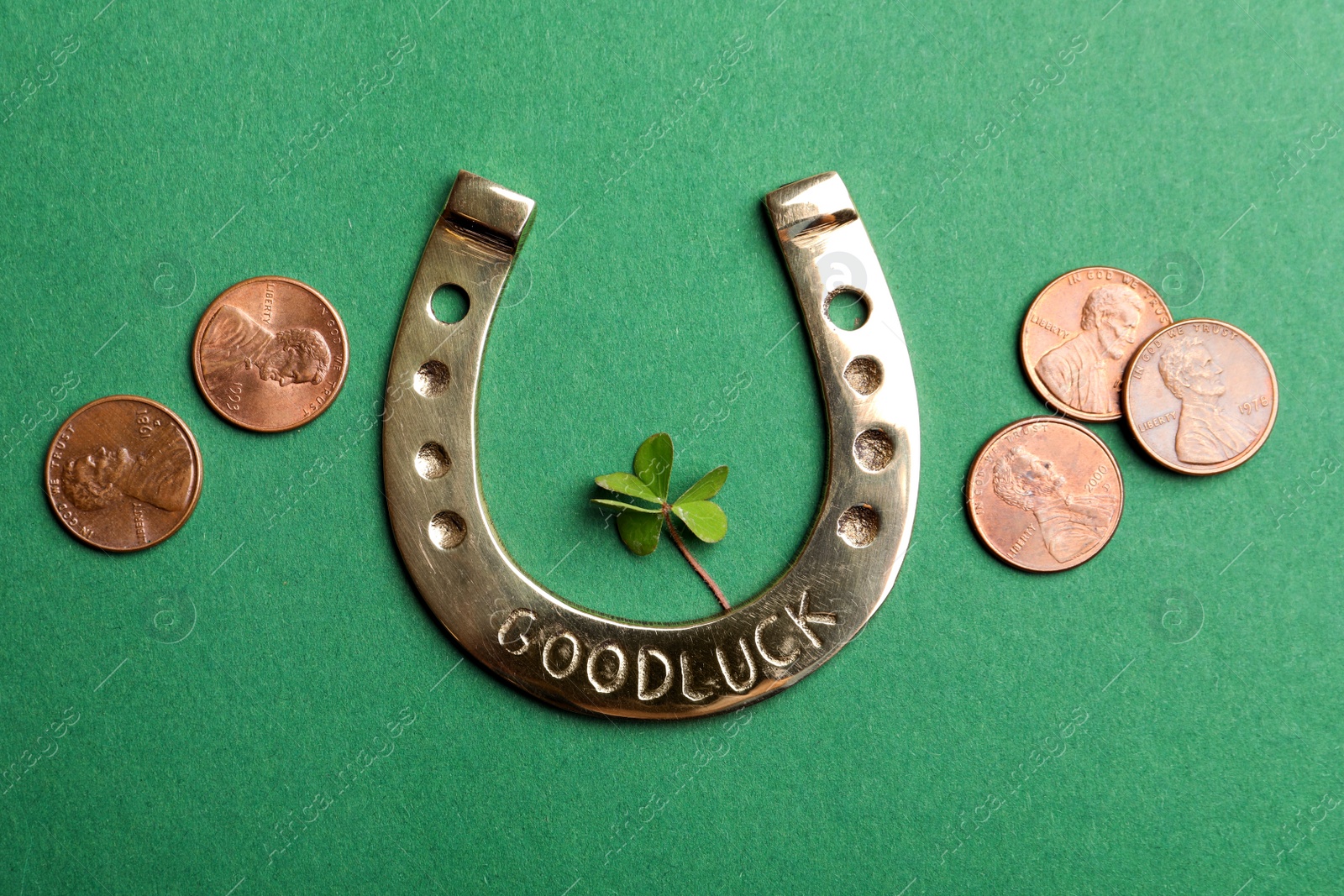 Photo of Flat lay composition with horseshoe on green background. St. Patrick's Day celebration