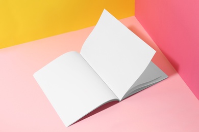 Photo of Empty book pages on color background. Mockup for design