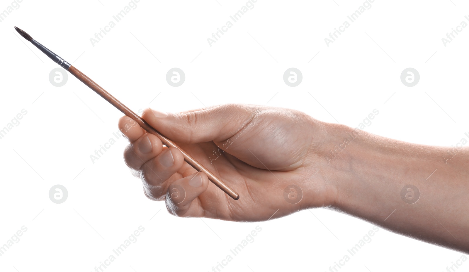 Photo of Man holding paint brush on white background, closeup