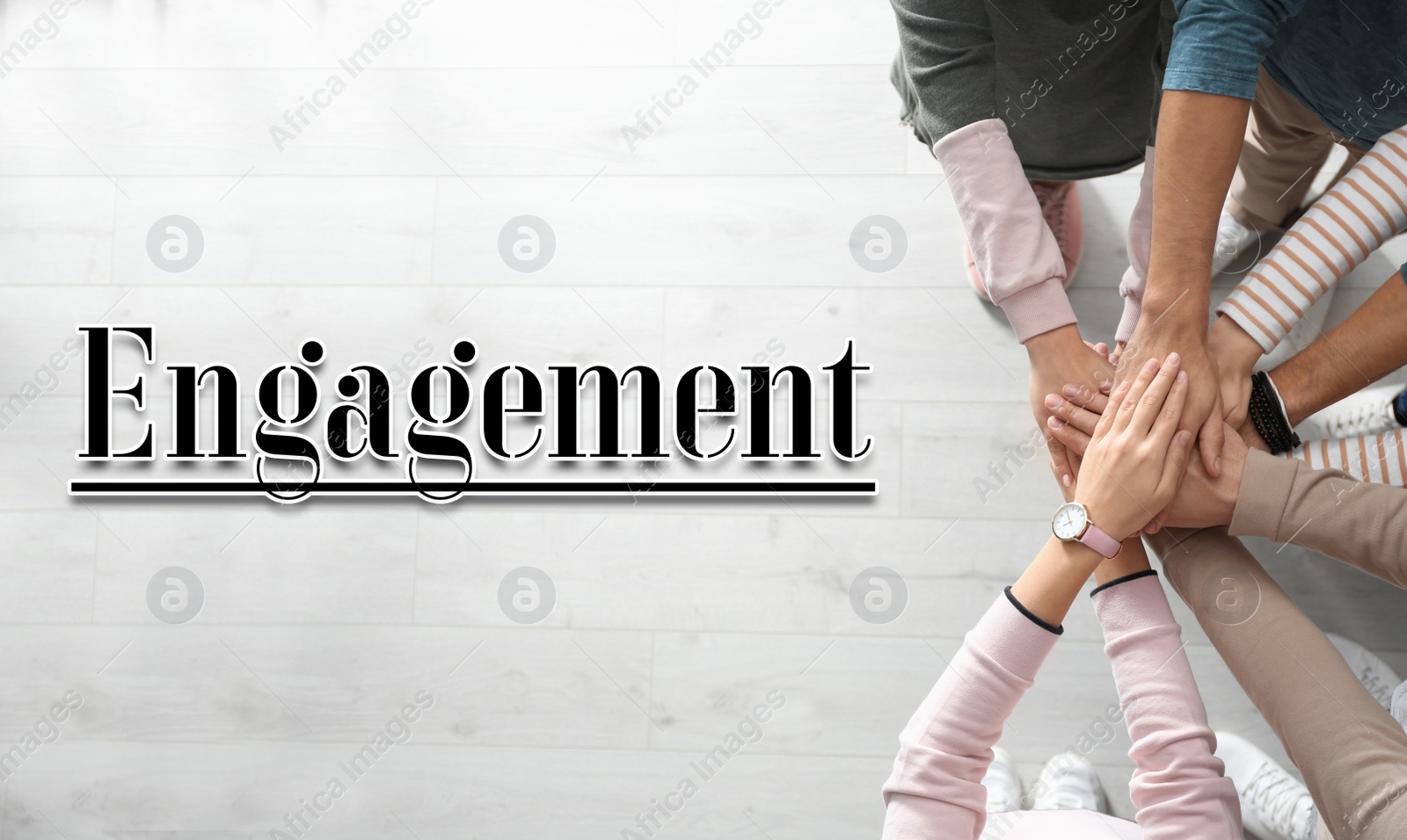 Image of Engagement concept. People holding hands together, top view 