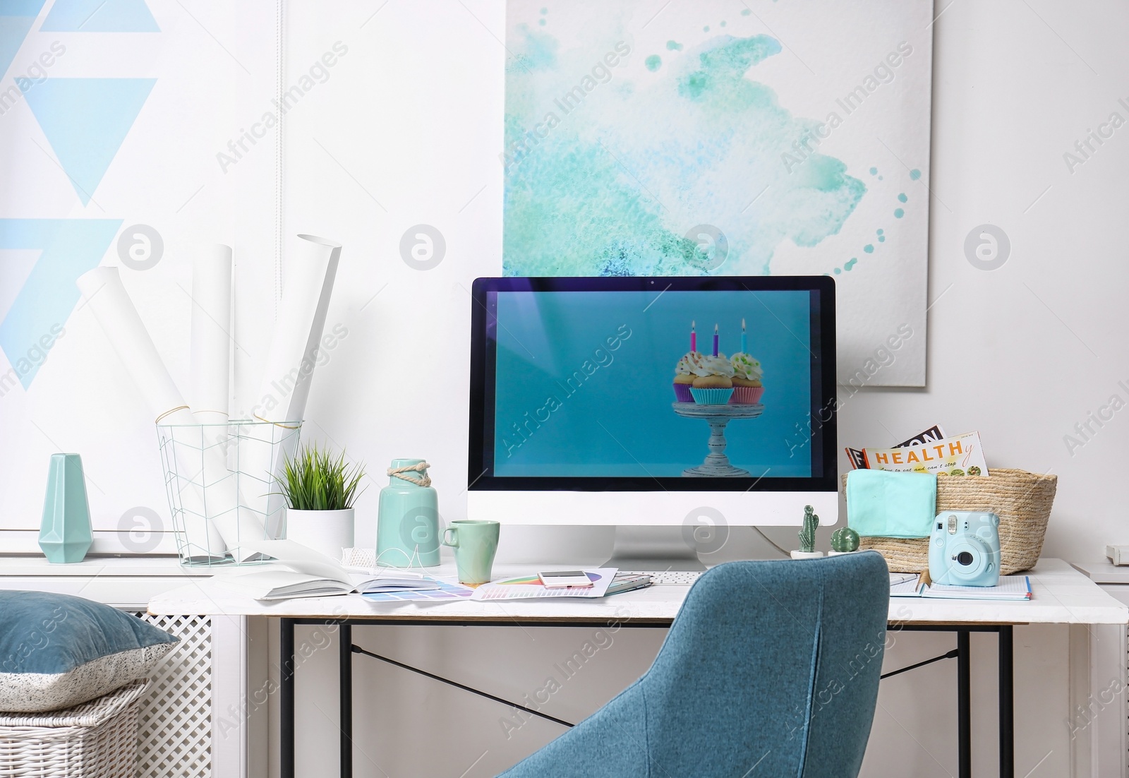 Photo of Comfortable designer's workplace with modern computer in studio