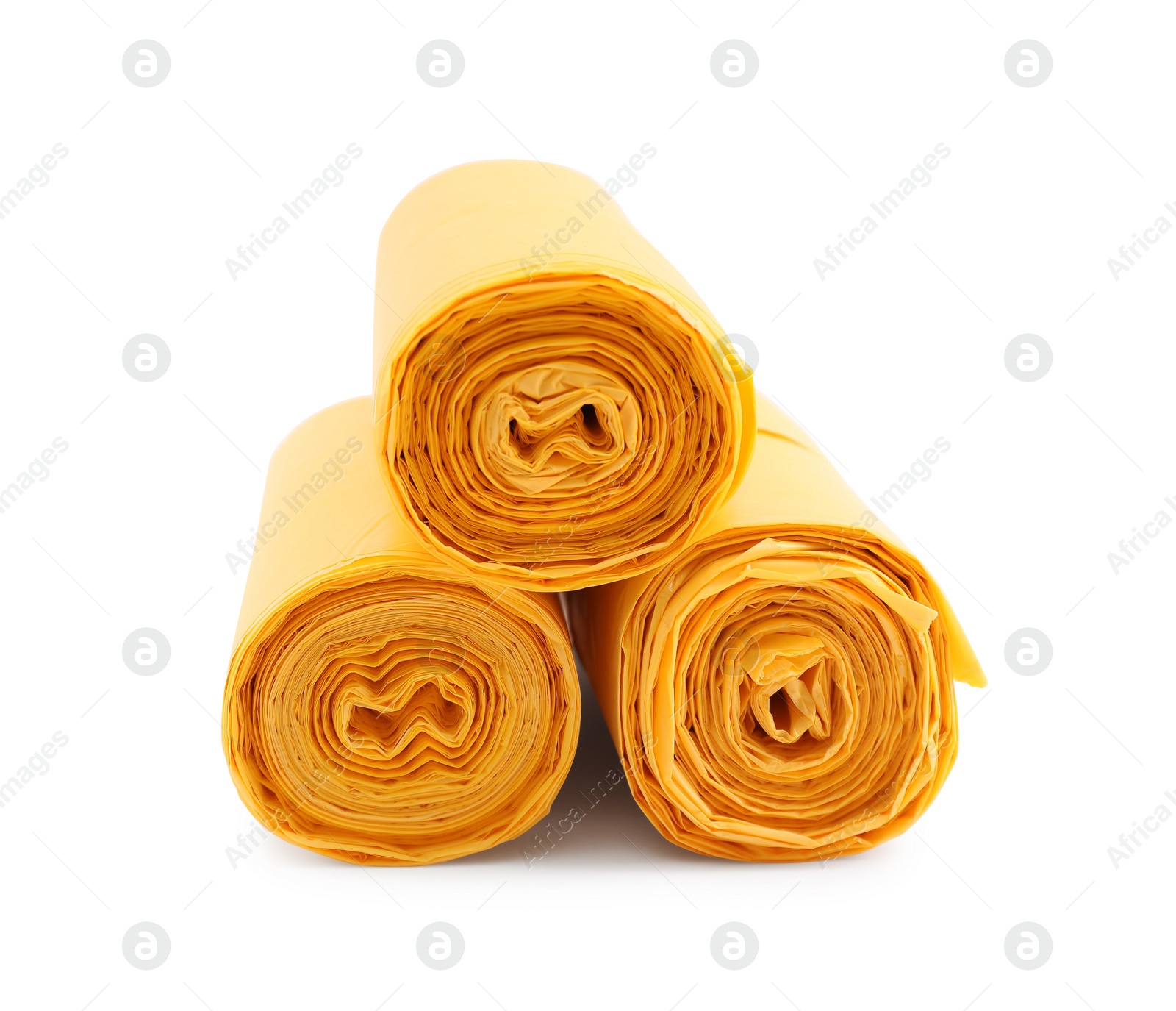 Photo of Rolls of yellow garbage bags isolated on white