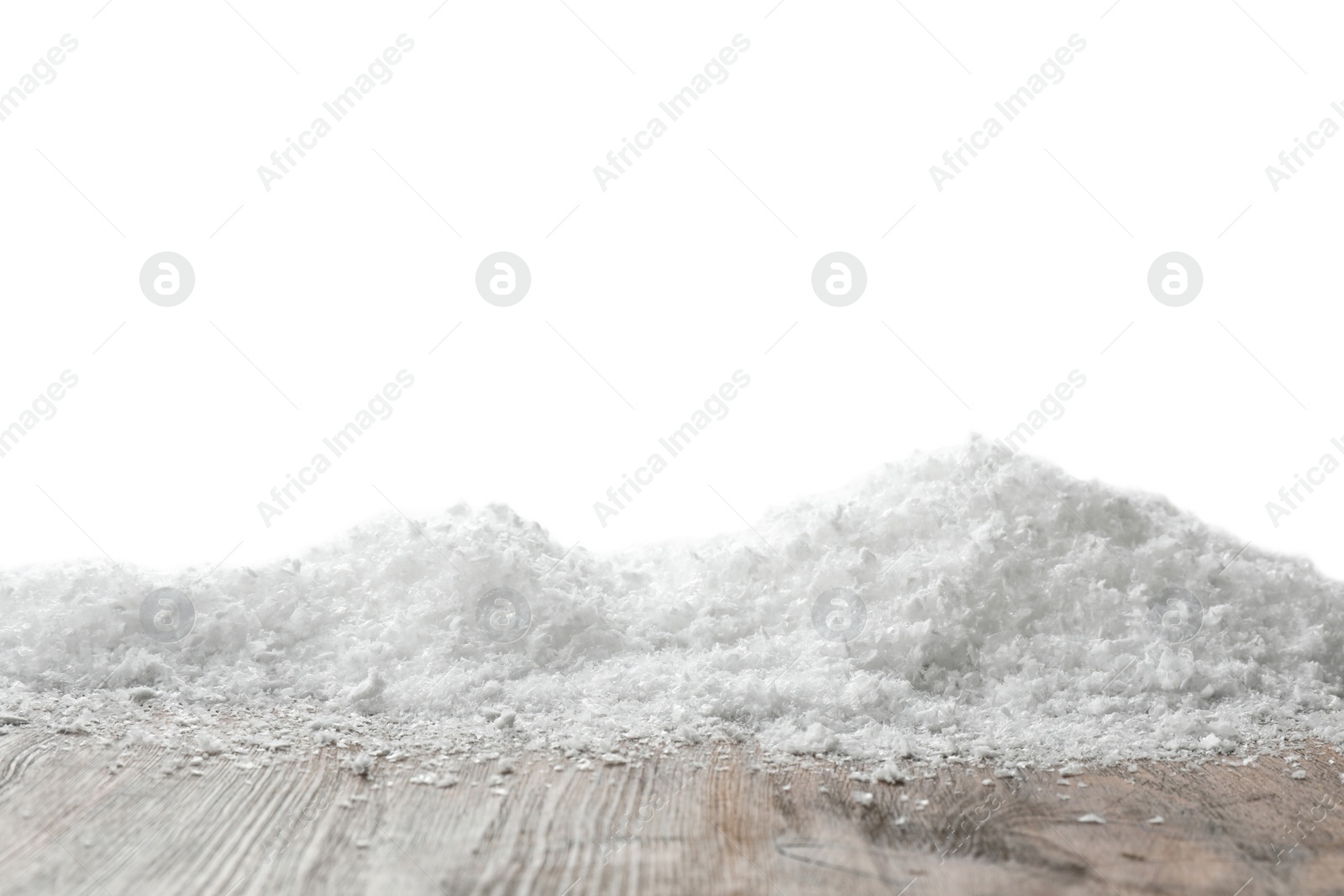 Photo of Wooden surface covered with snow against white background