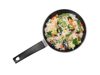 Photo of Tasty rice with vegetables in frying pan isolated on white, top view