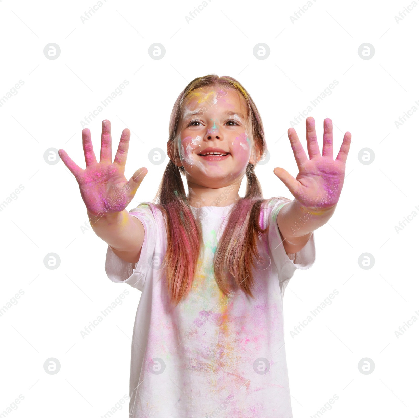 Photo of Cute little girl covered with colorful powder dyes on white background. Holi festival celebration