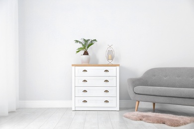 Photo of Chest of drawers in stylish living room interior