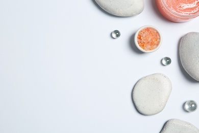 Flat lay composition with spa stones and space for text on white background