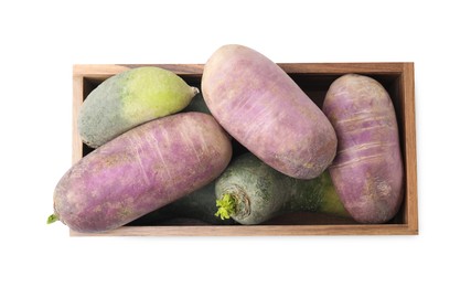 Photo of Purple and green daikon radishes in wooden crate isolated on white, top view