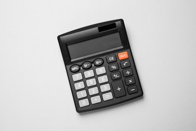 Photo of Calculator on light gray background, top view. Office equipment