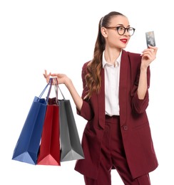 Photo of Stylish young businesswoman with shopping bags and credit card on white background