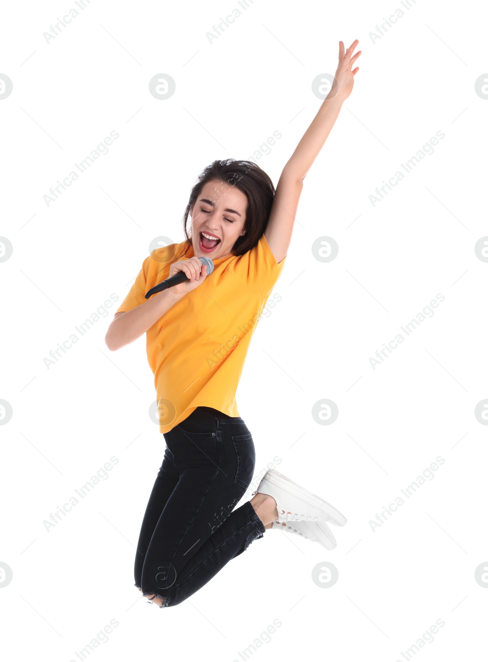 Photo of Young woman wearing casual clothes singing in microphone on white background