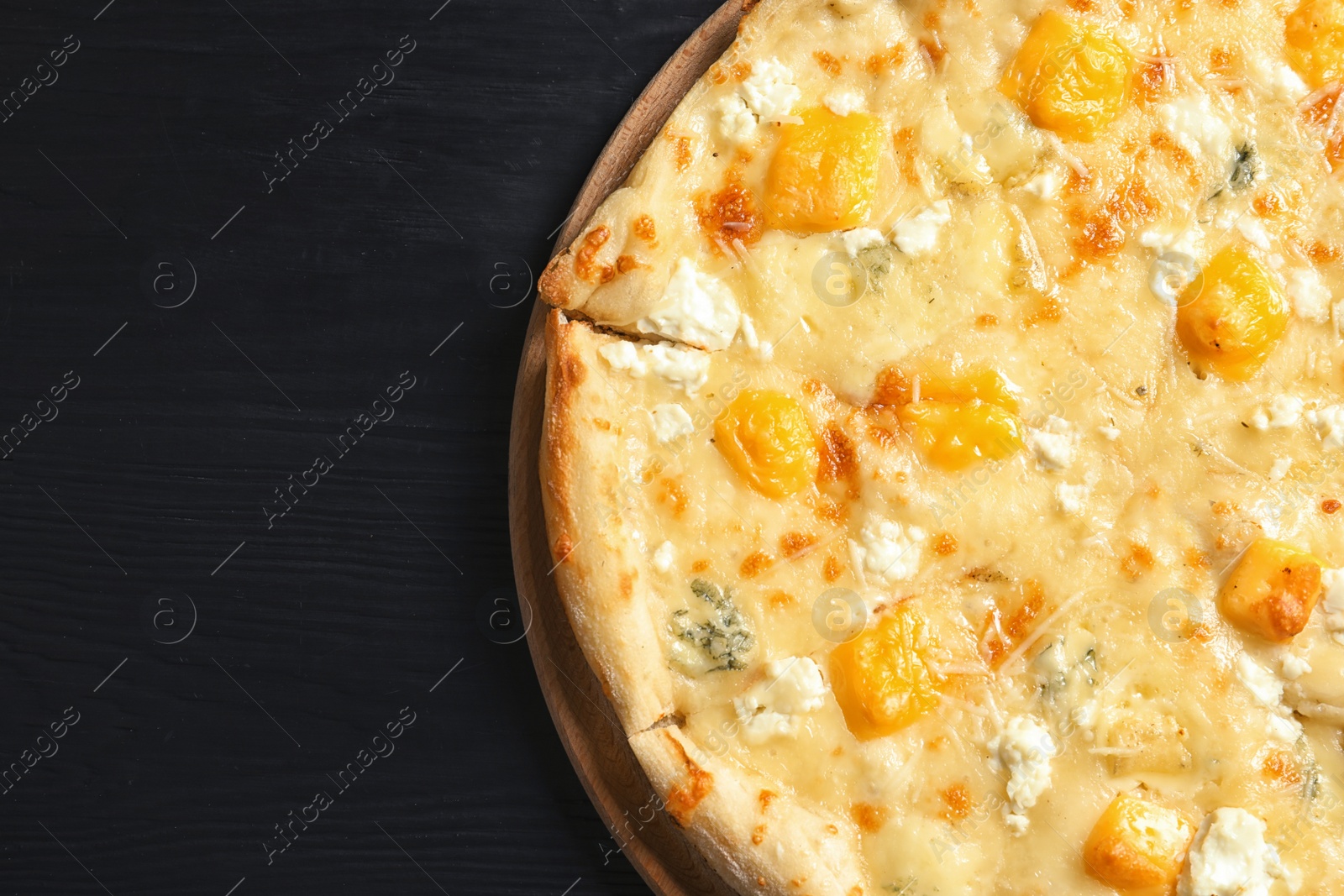 Photo of Hot cheese pizza Margherita on wooden table, top view. Space for text