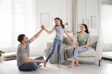 Photo of Happy family spending time together at home. Adoption concept