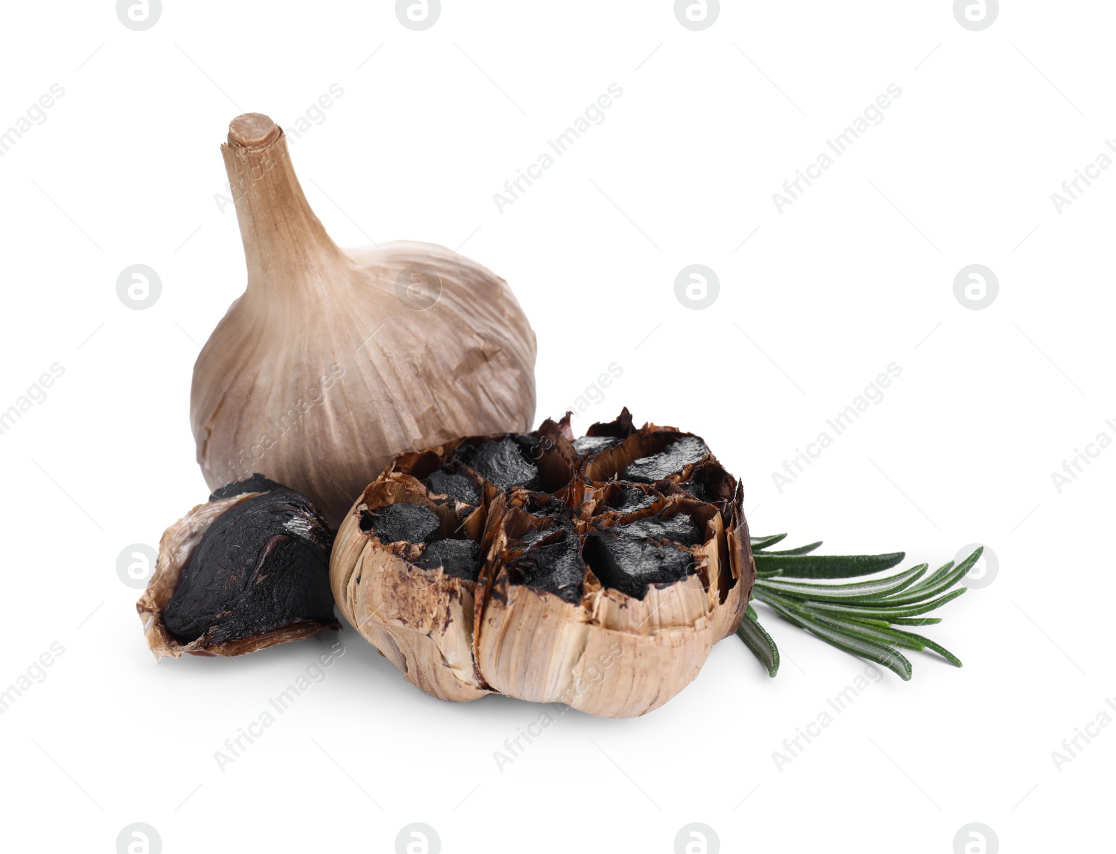 Photo of Fermented black garlic and rosemary isolated on white