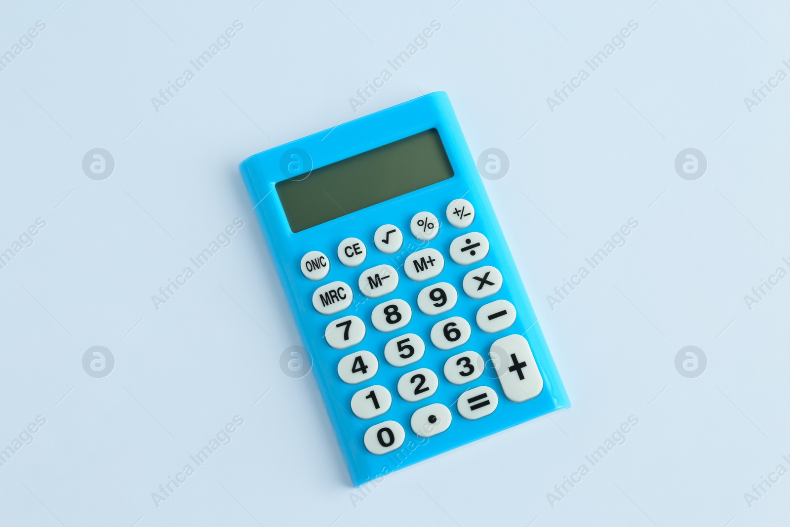 Photo of Light blue calculator on white background, top view