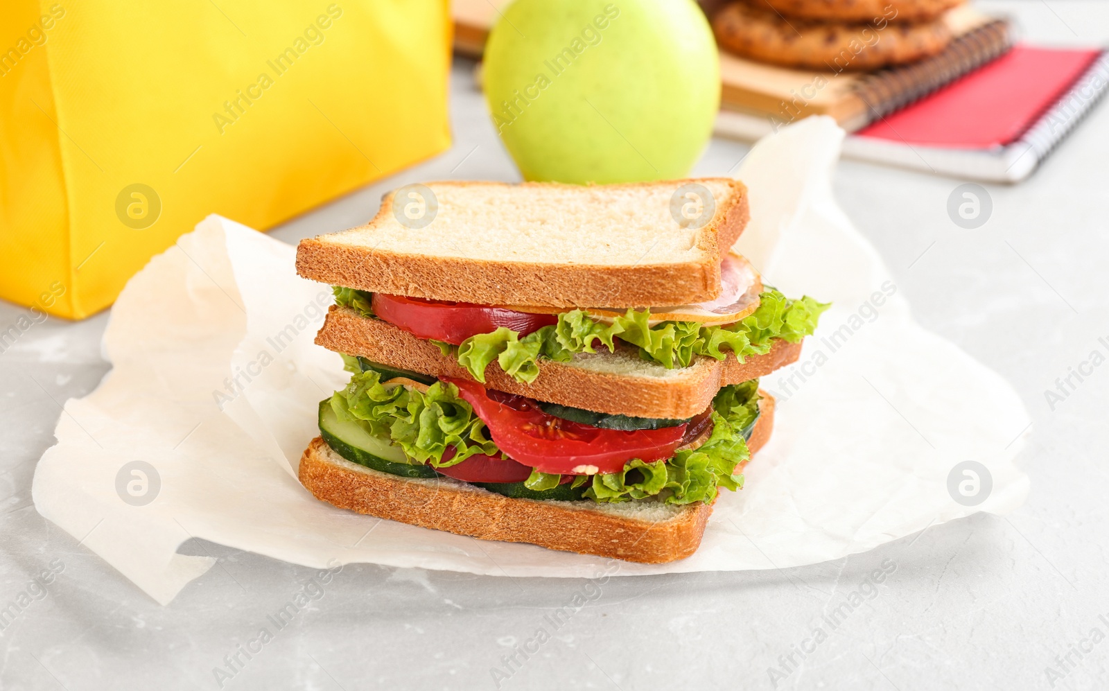 Photo of Delicious sandwich with fresh vegetables on table