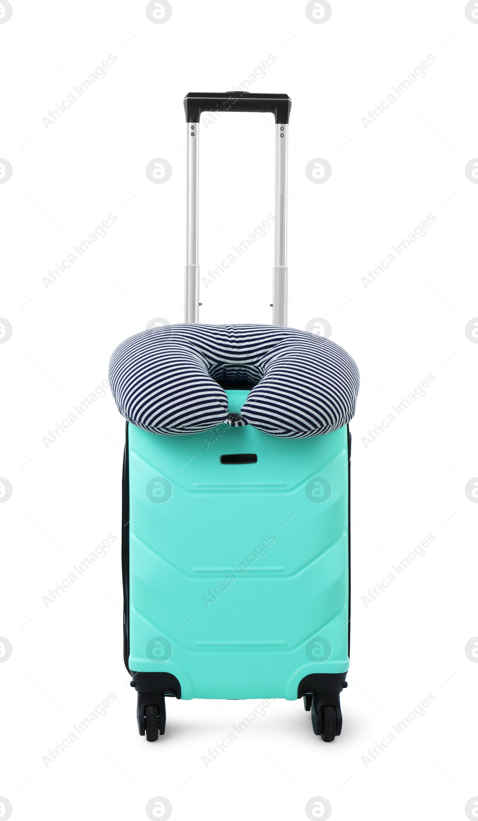 Photo of Soft travel pillow on turquoise suitcase isolated on white