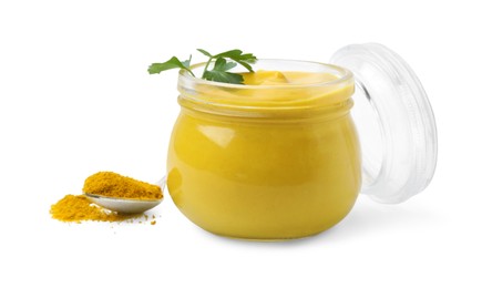 Photo of Jar with tasty curry sauce, powder and parsley isolated on white