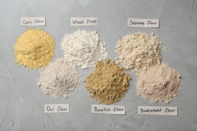 Photo of Composition with different types of flour on light background