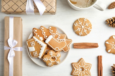 Photo of Flat lay composition with tasty homemade Christmas cookies on wooden table