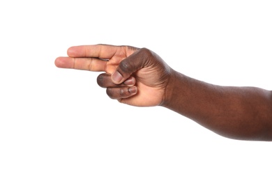 Photo of African-American man showing shoot gesture on white background, closeup