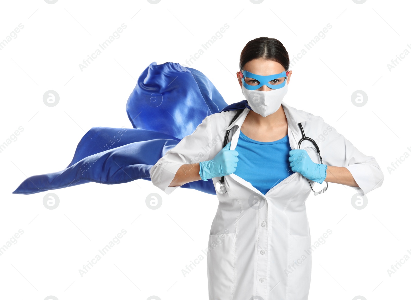 Photo of Doctor dressed as superhero posing on white background. Concept of medical workers fighting with COVID-19