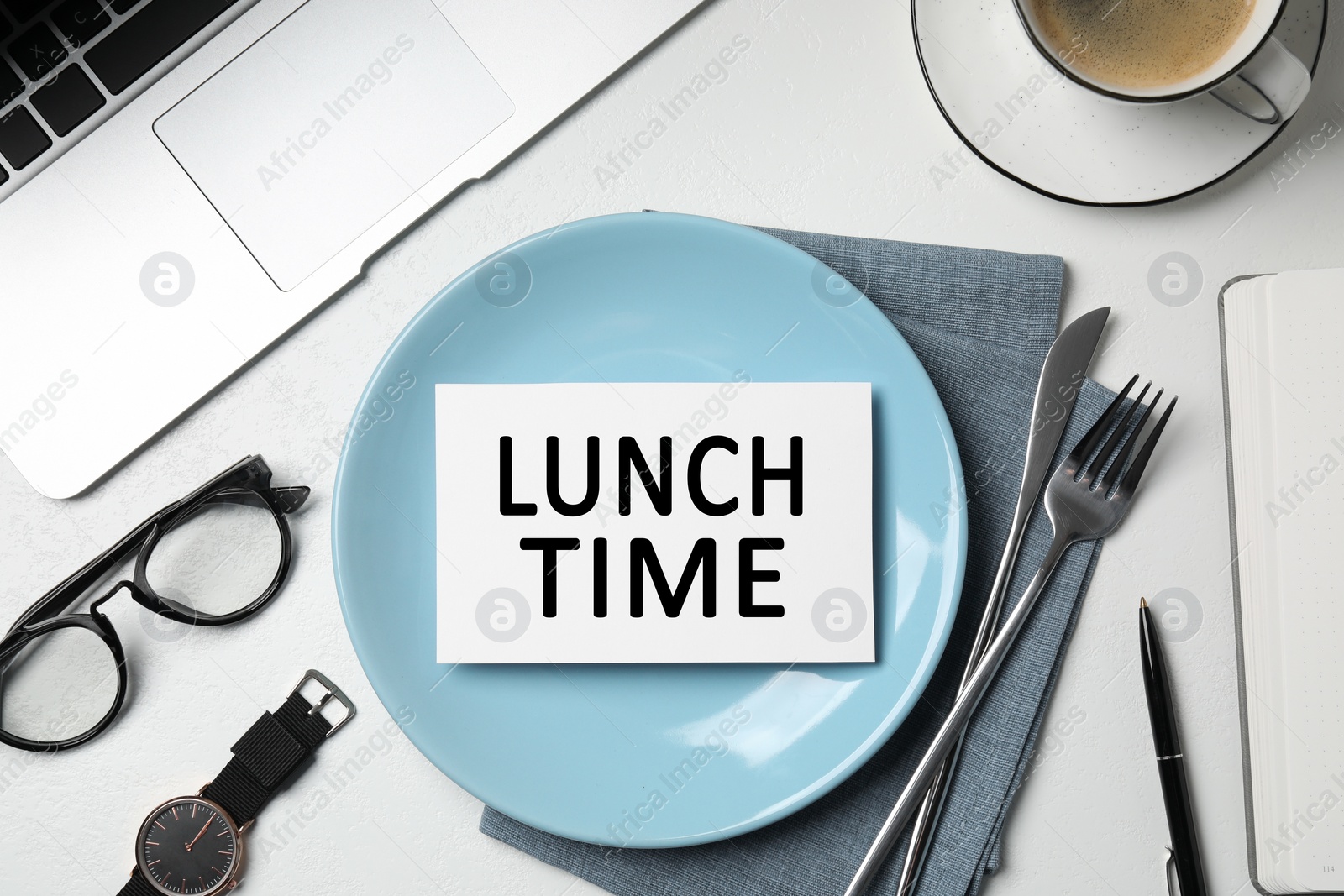 Image of Business lunch. Office desk with plate, cutlery and laptop, flat lay. Card with phrase Lunch Time on dish