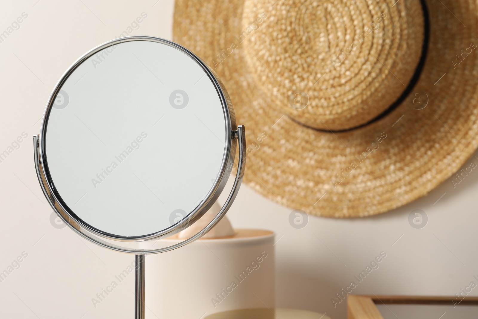 Photo of Mirror and hat in makeup room, closeup