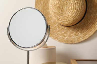Mirror and hat in makeup room, closeup