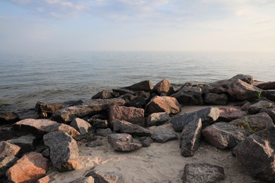 Beautiful view sandy sea beach with rocks